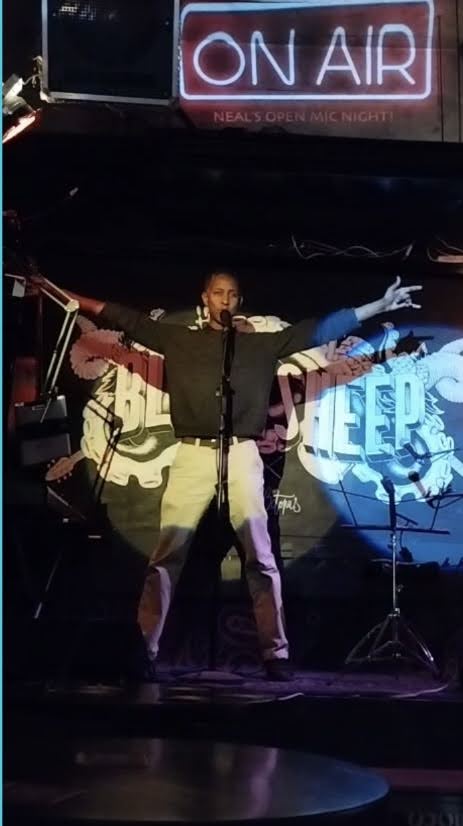 BerTz performing on stage at Black Sheep, MPL25 open mic